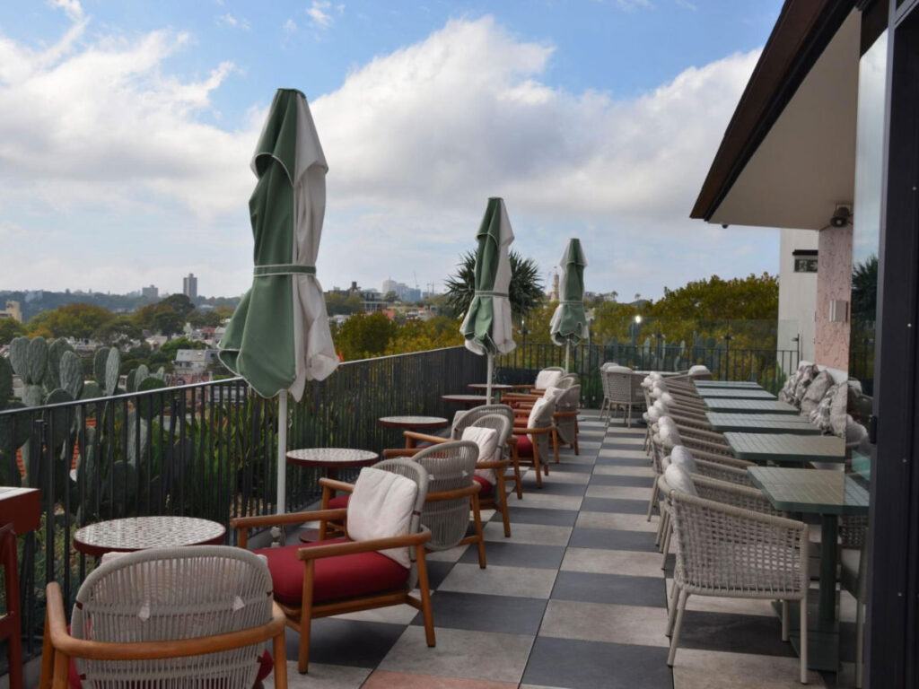 View of the outdoor seating of a restaurant at 25hours Hotel Sydney The Olympia
