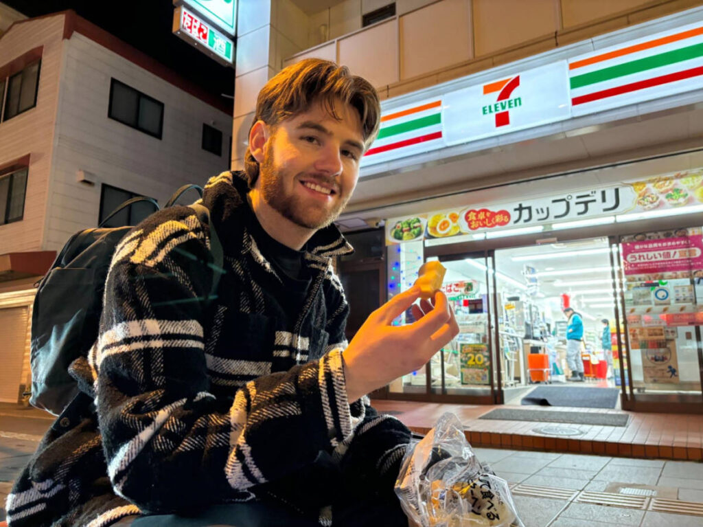 The author's boyfriend, Michael eating his 7-Eleven jelly-filled pancakes