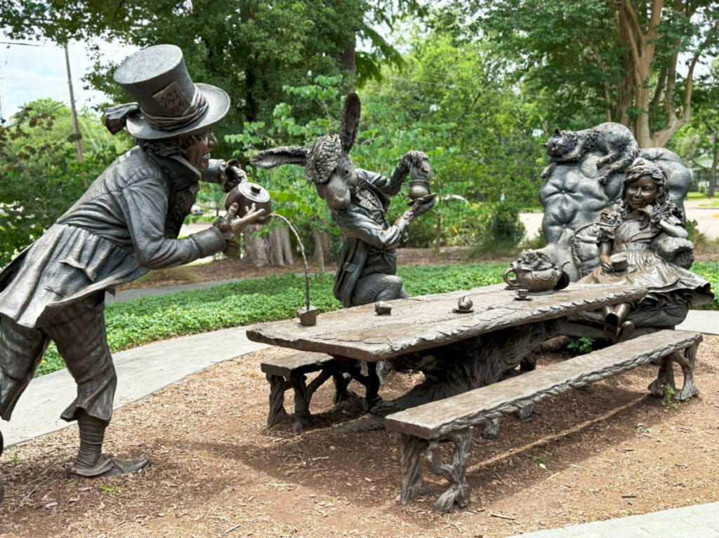 A sculpture of the Wonderland Tea Party at Evelyn’s Park