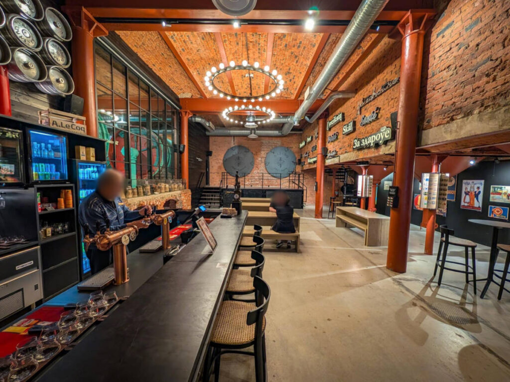 People drinking inside the A. Le Coq Beer Museum