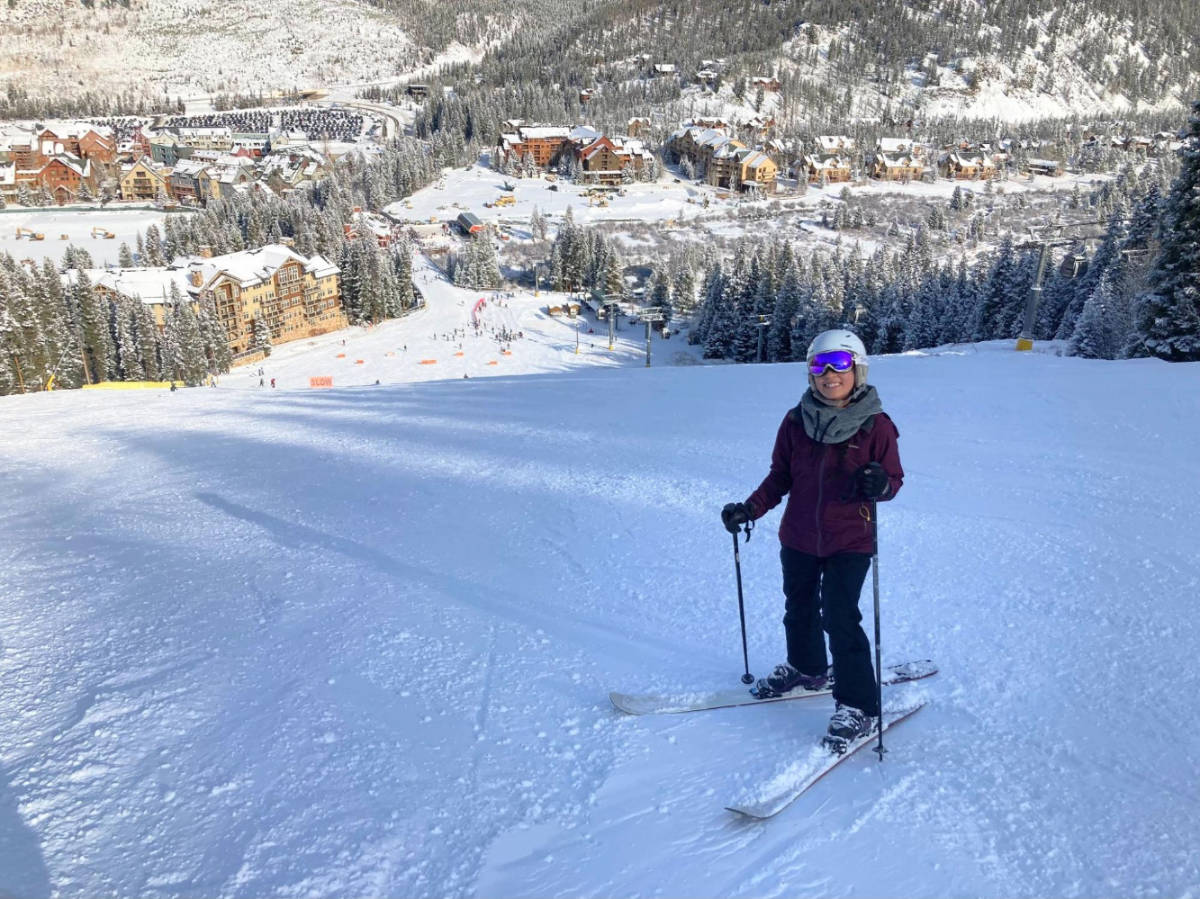 The author, Abigail Bliss with the Mountain House and River Run Village on her background