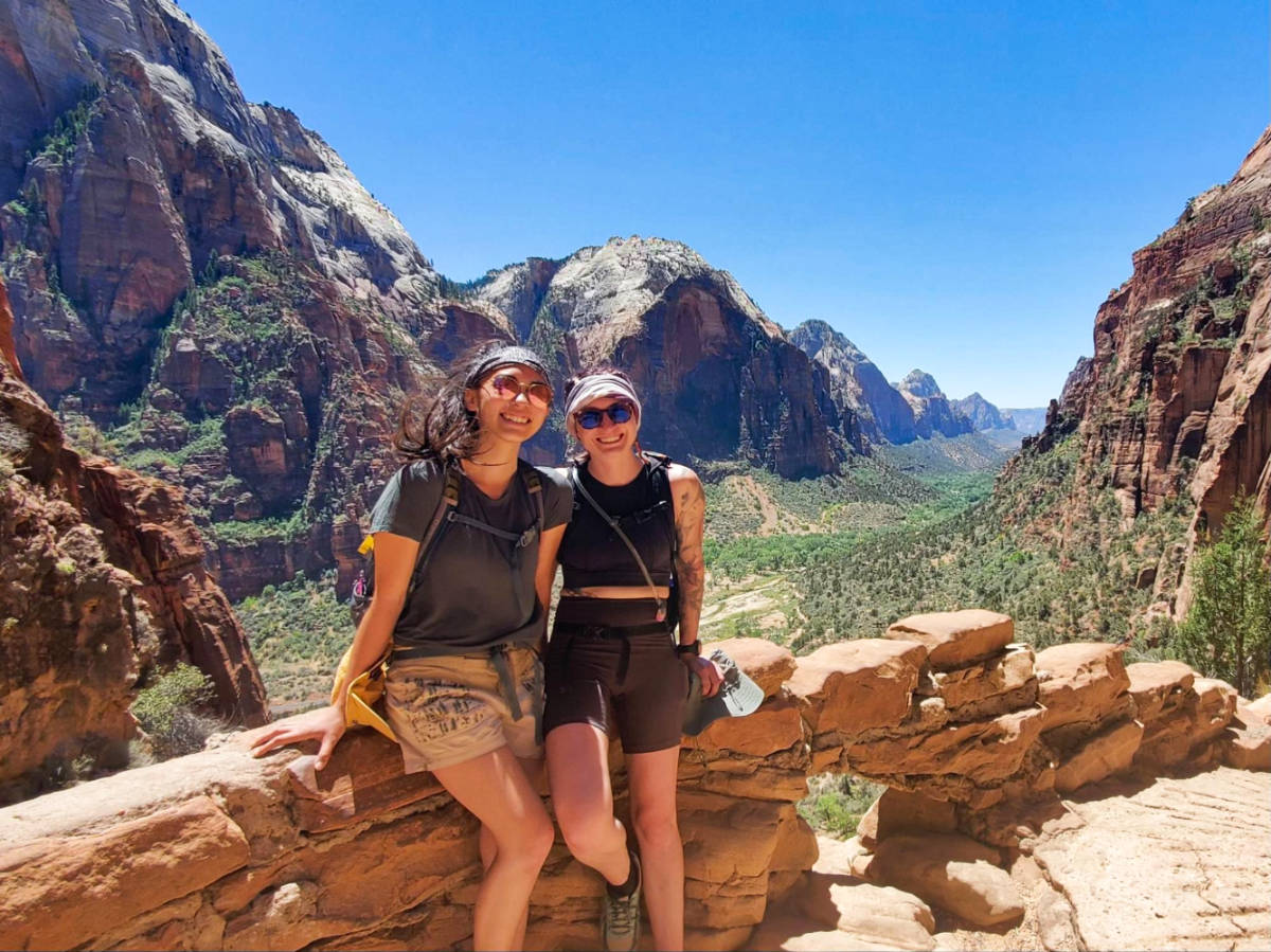 Travel Lemming Editor, Abigail, and her best friend posing at the Angels Landing Trail