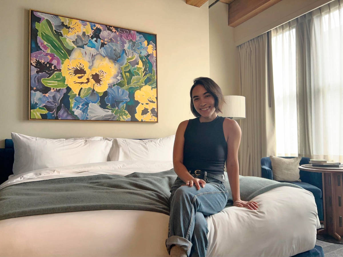 Travel Lemming editor, Abigail Bliss smiling for a photo at Populus Seattle