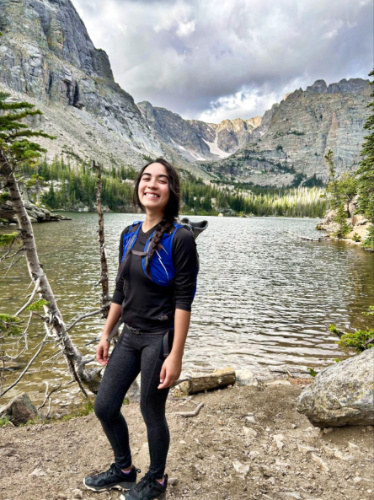 The author Abigail Bliss, posing for a photo one her hike to Rocky Mountain National Park