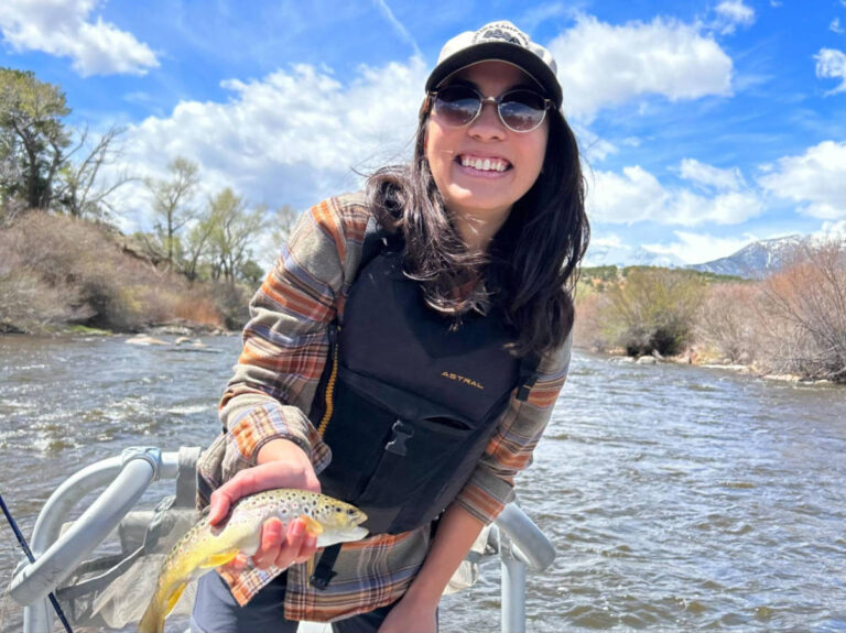 The author Abigail Bliss, holding a fish caught from fly fishing in Buena Vista