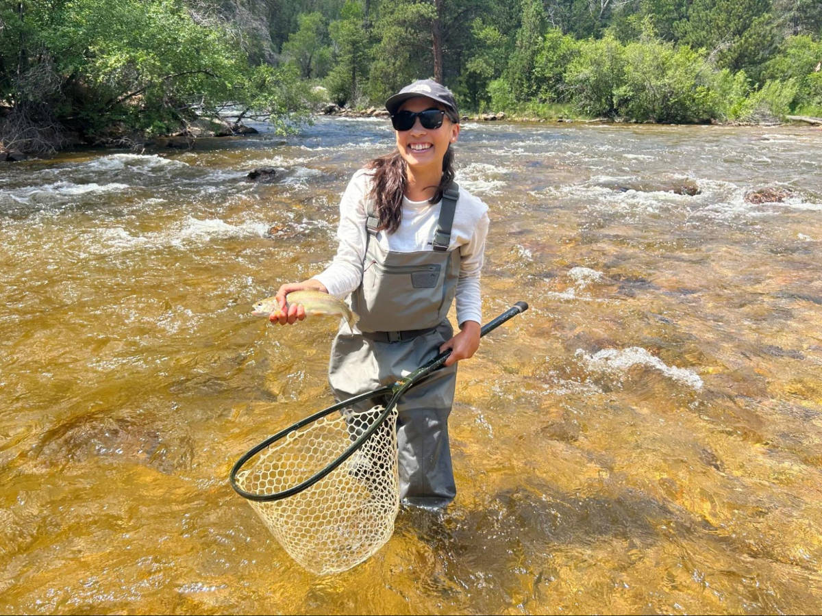 The author Abigail Bliss, fly fishing on the Cache la Poudre River
