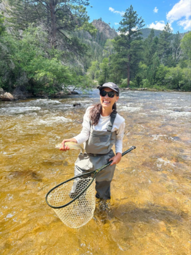The author Abigail Bliss, fly fishing on the Cache la Poudre 