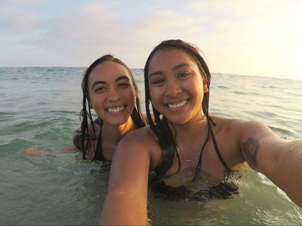 Travel Lemming author Abigail Bliss and her friend, swimming on the beach in Newport