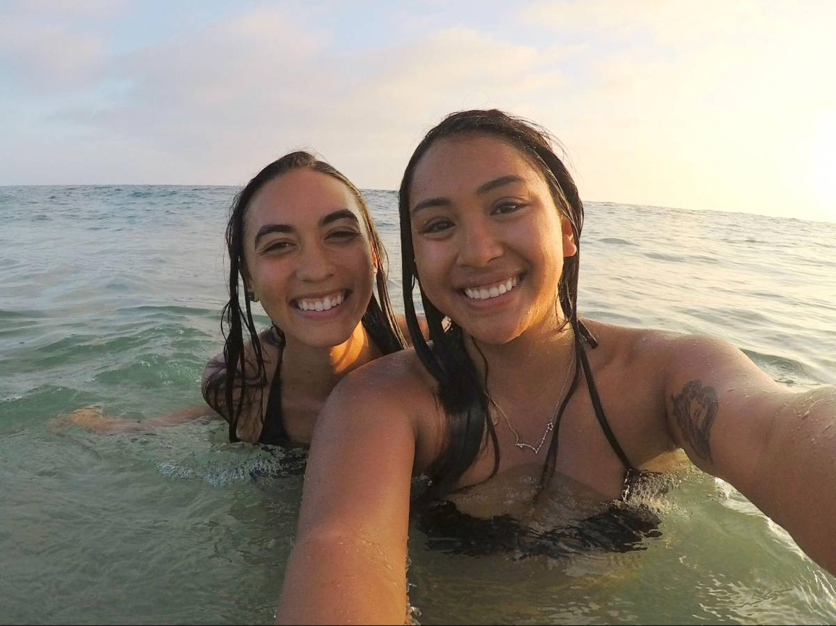 Travel Lemming author Abigail Bliss and her friend, swimming on the beach in Newport