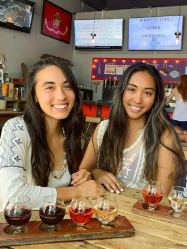 Travel Lemming Editor Abigail Bliss and her friend at Barrels & Bottles Brewery