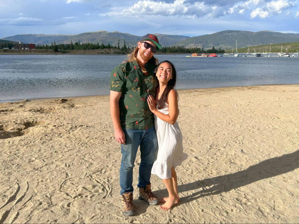Travel Lemming Editor Abigail Bliss and her husband, posing a for a photo at the marina on a sunny day
