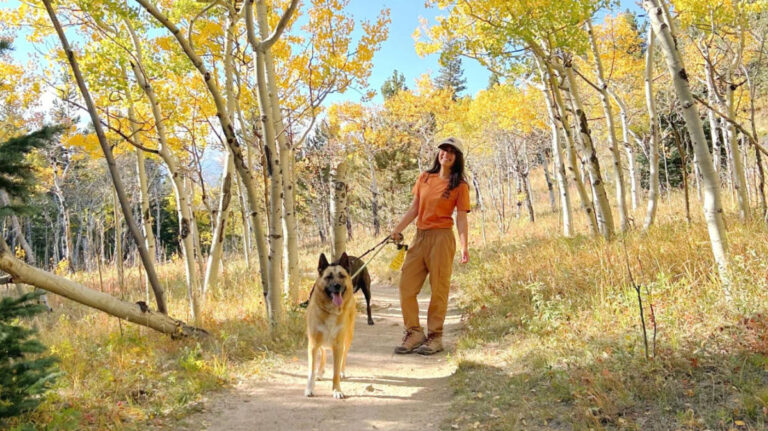 The author Abigail Bliss, hiking with her pups along the fall foliage in Golden Gate Canyon State Park