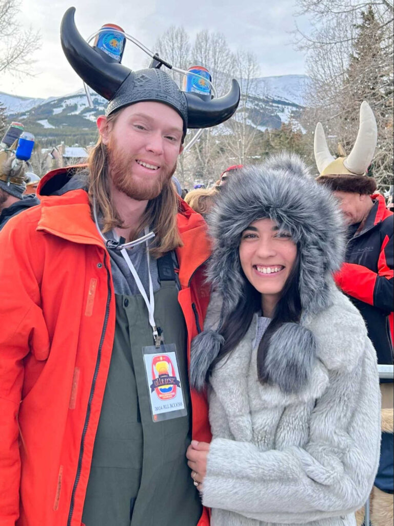 Travel Lemming writer Abigail Bliss and her husband, wearing a Viking helmet at the Ullr Fest