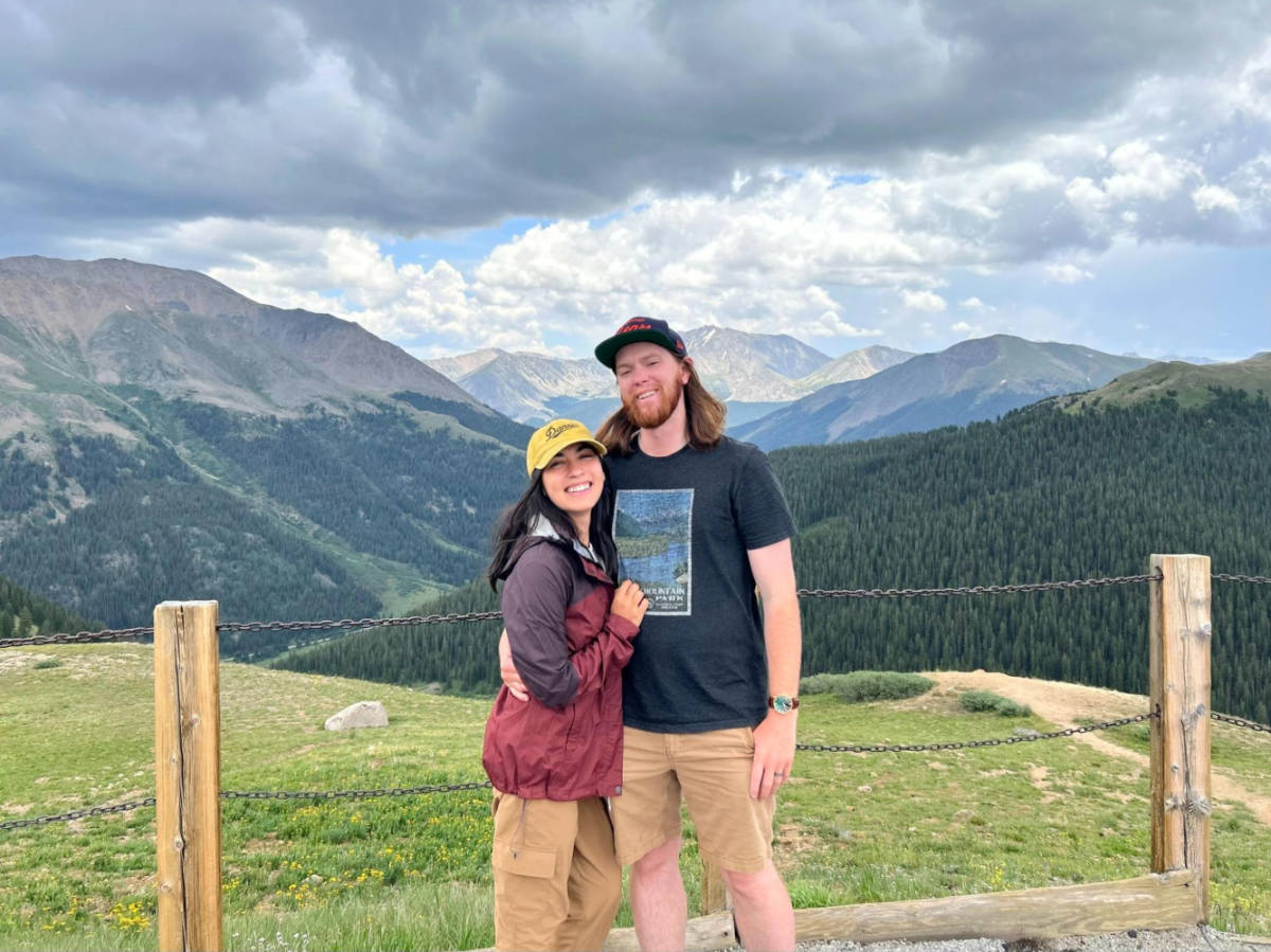 The author Abigail Bliss and husband, posing for a photo with scenic overlooking view of the Independence Pass