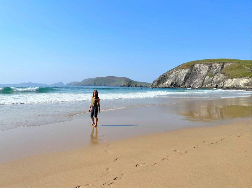 The author Abigail Bliss walking along the shoreline of Coumeenoole Beach