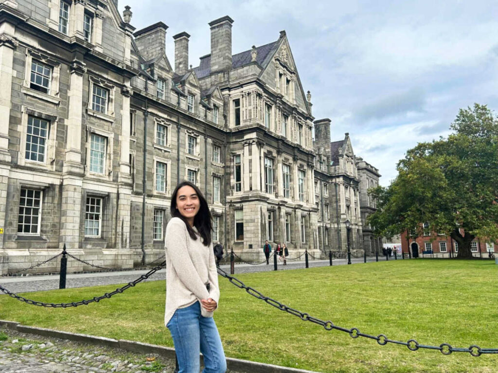The author Abigail posing for a photo outside the Trinity College