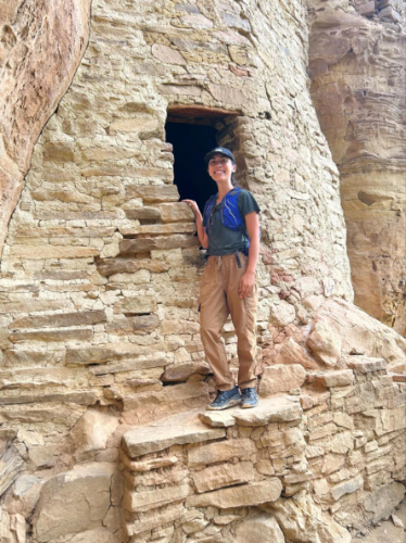 The author Abigail Bliss, standing at a cliff dwelling in Ute Mountain Tribal Park