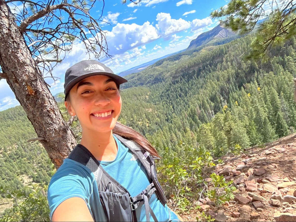The author Abigail Bliss, smiling for a photo via the Colorado Trail