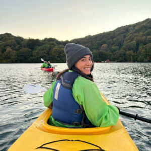 The author Abigail Bliss enjoying her kayak ride on the lake