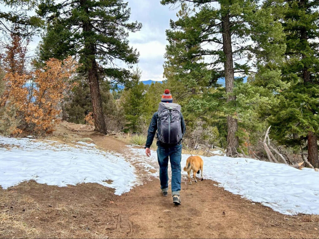 The author's husband and pup hiking near Lakewood in winter