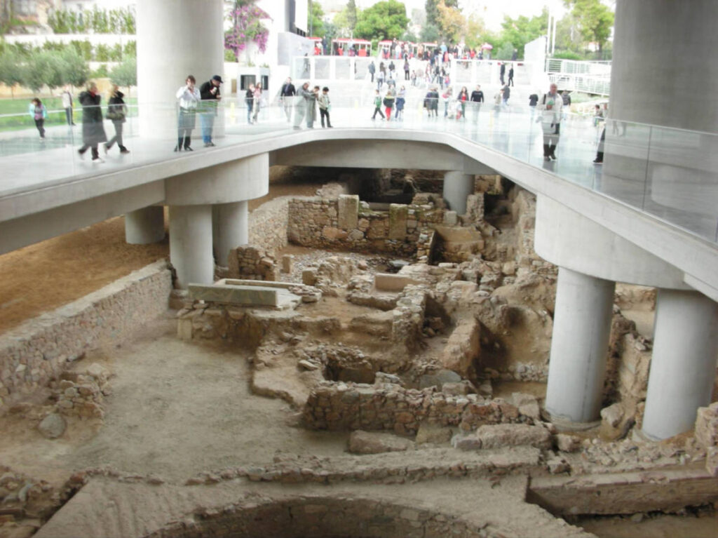 View of the excavated remains of the 4,500-year-old Roman Village at the entrance of the Acropolis Museum