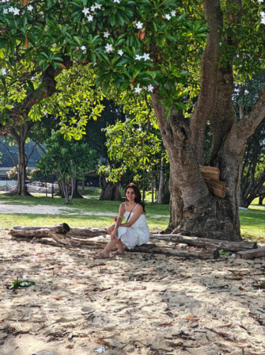 The author Advaita, sitting under the tree at the East Coast Park
