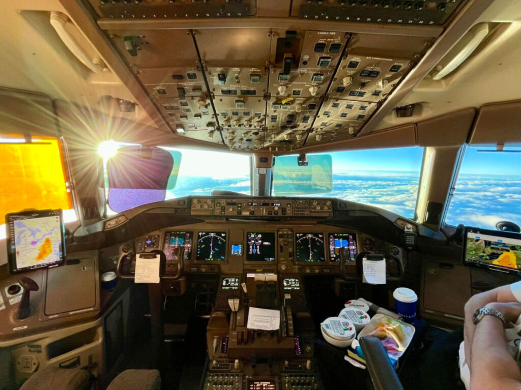 Airplane cockpit with controls and instruments in sight