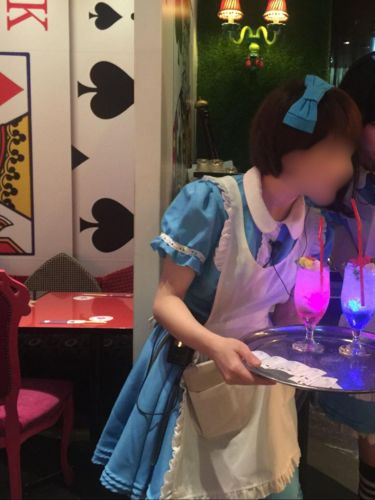 A server in Alice-In-Wonderland Cafe in Japan