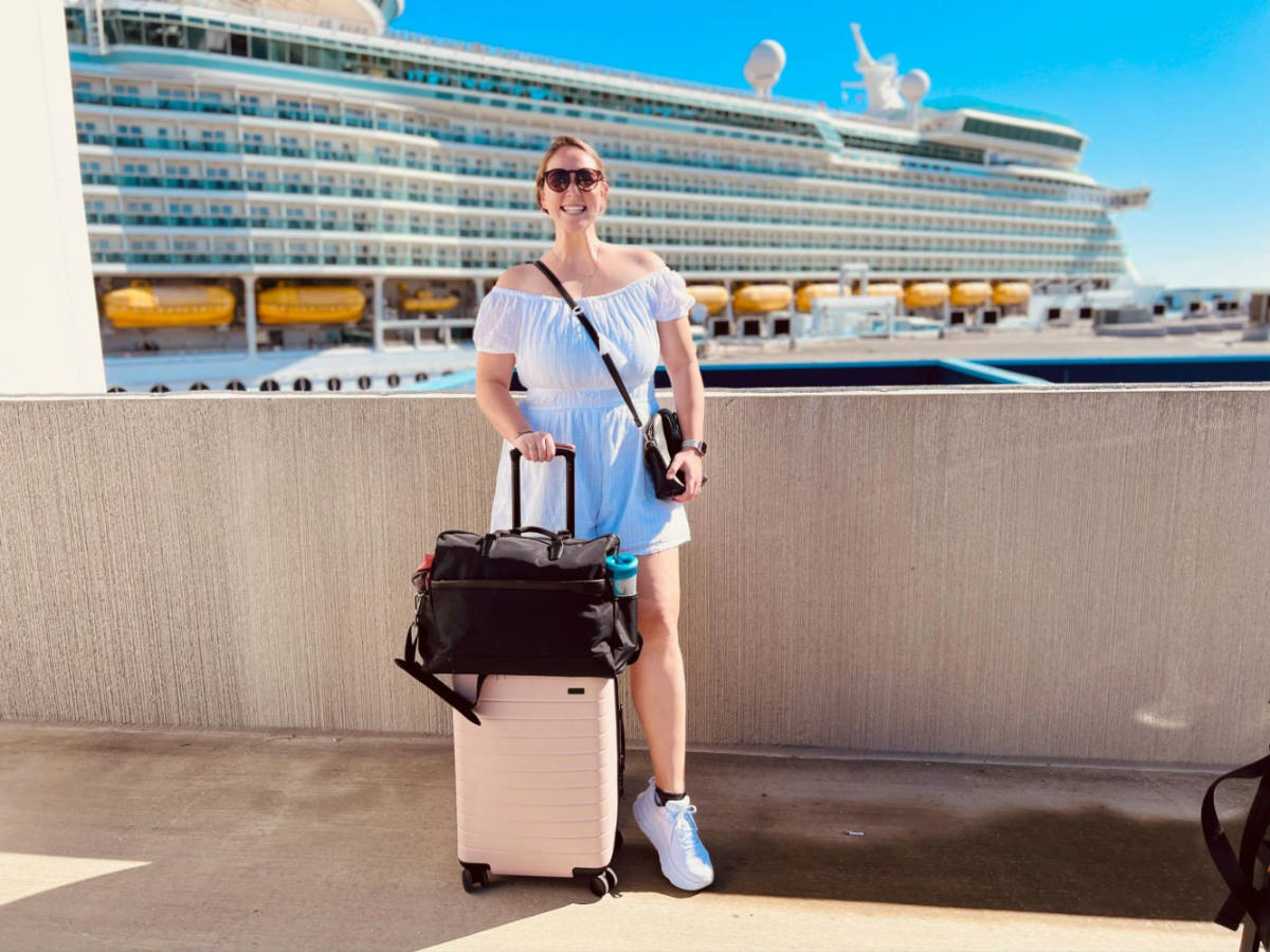 The author Allie Hubers, posing for a photo while boarding the Royal Caribbean’s Mariner of the Seas