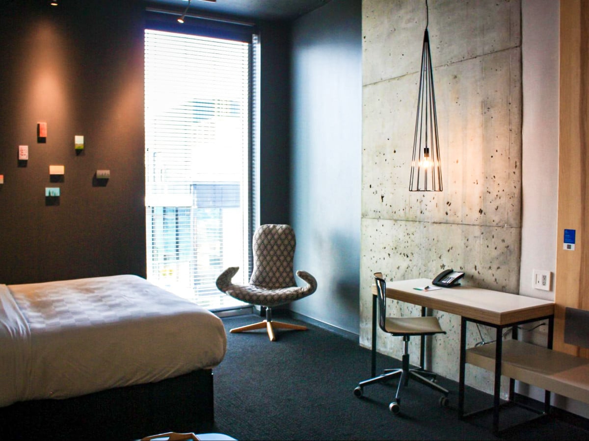 View of the huge window near the workspace inside the suite of Alt Hotel