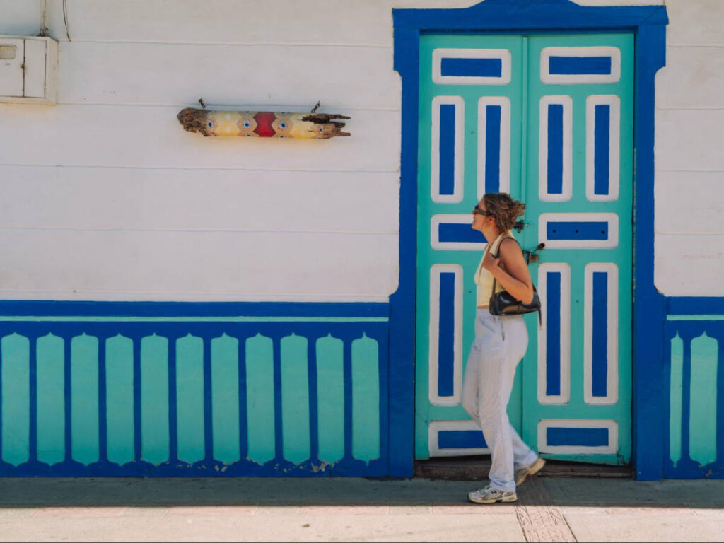 The author Amber Visch, walking through the colorful streets of Salento
