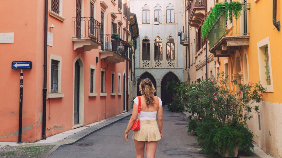 The author, Amber Visch walking on a street in Verona