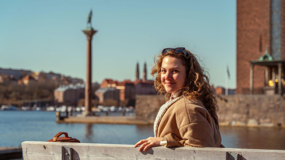 The author Amber Visch, enjoying the skyline views at a waterfront in Stockholm