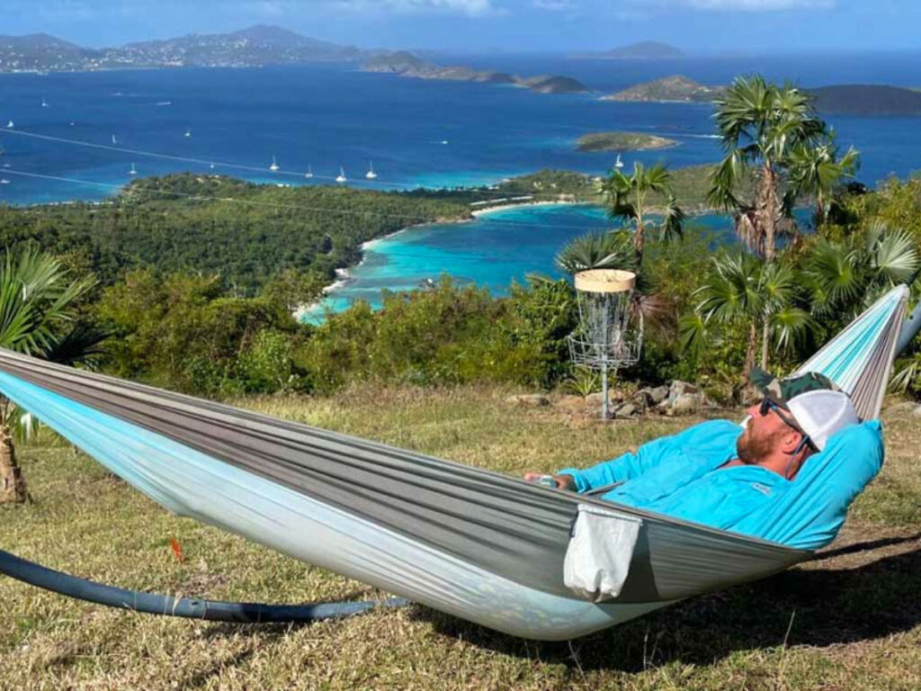 Travel Lemming senior writer Andrew rests in a hammock, gazing at the ocean in the US Virgin Islands