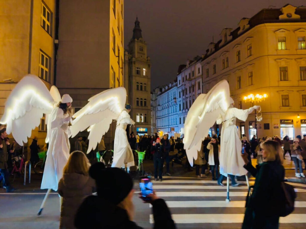View of the angels on a parade through the Old Town streets at night