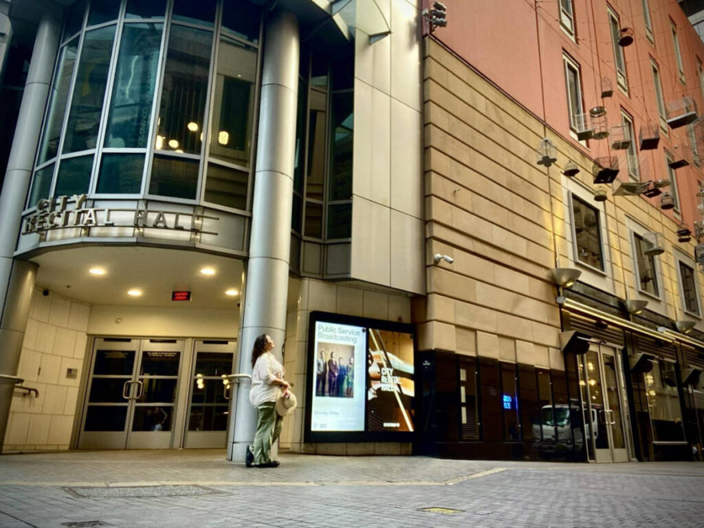 The author Ann-Marie Cahill, standing outside the City Recital Hall