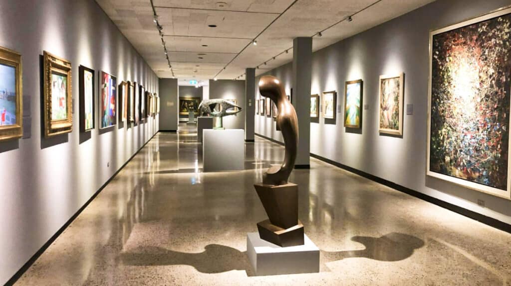 View of sculptures and paintings inside Winnipeg Art Gallery