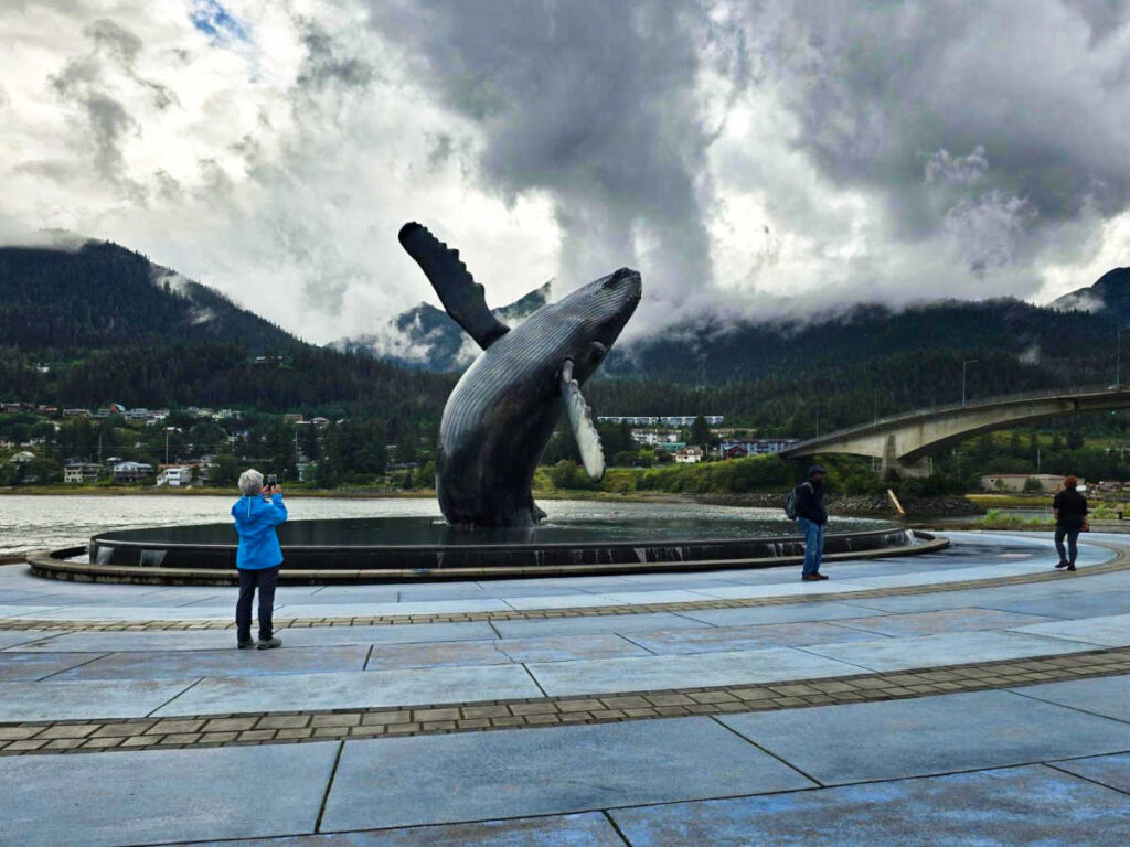 People admiring the wildlife sculpture at the city center