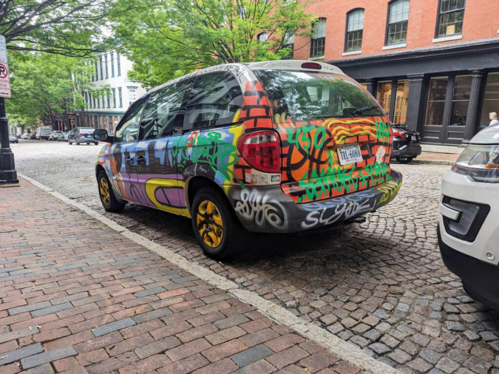 A colorful art on a car parked in Shockoe Bottom