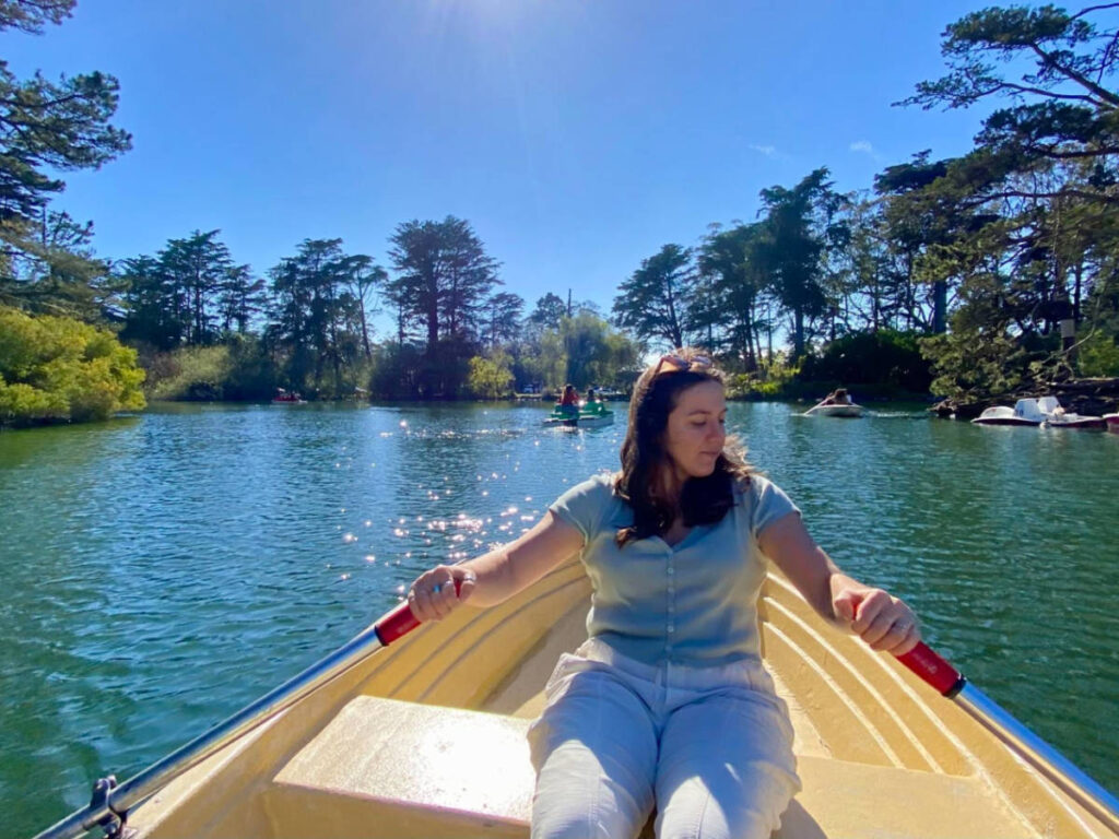 The author's partner rowing a boat at the Blue Heron Lake