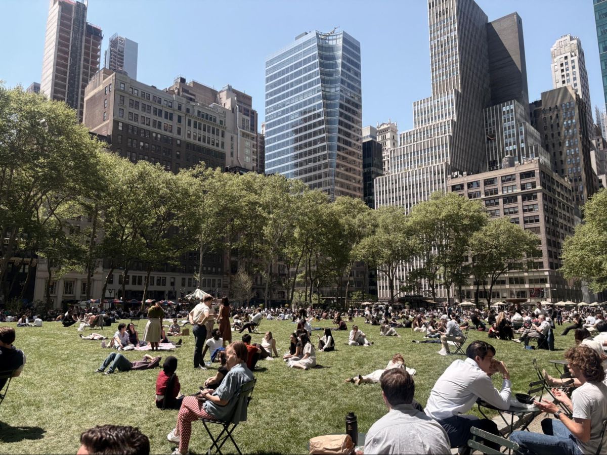 People relaxing at Bryant Park on a summer afternoon
