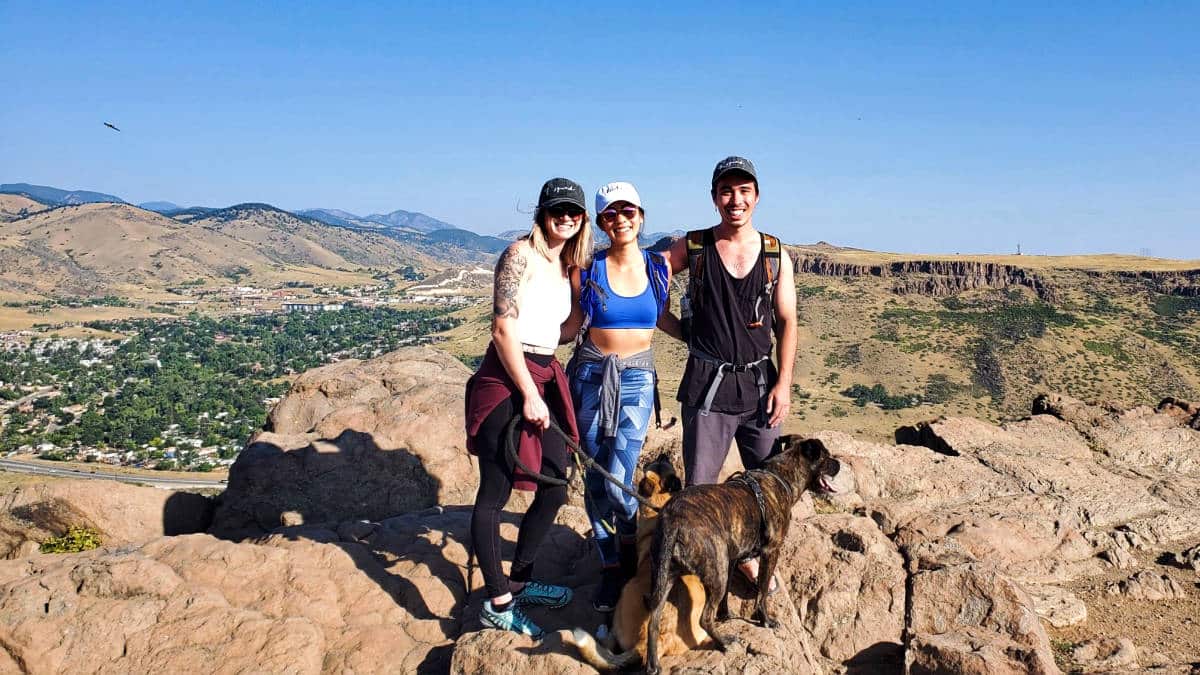 A group of friends and a dog posing at North Table Mountain