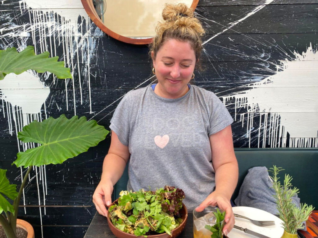 Author Jess enjoying a salad meal at Atelier Manna in Leucadia