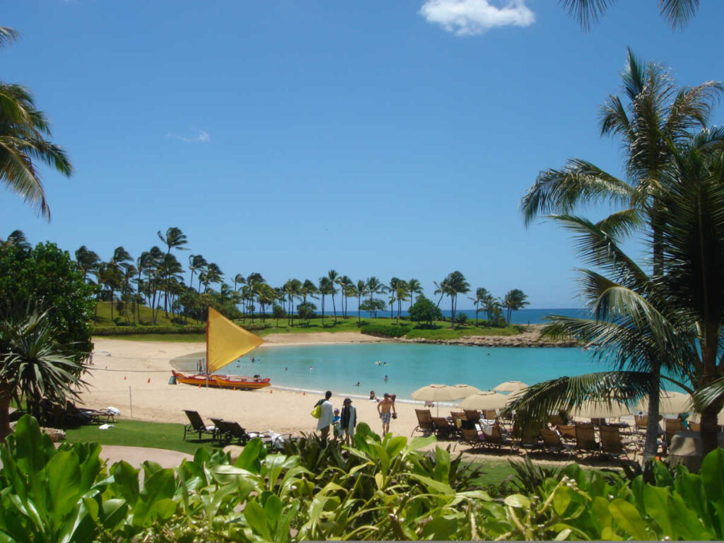View of the shoreline surrounded by greenery at Aulani
