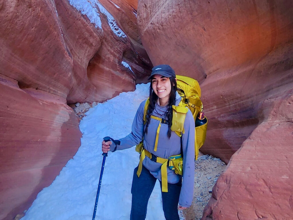 The author, Abigail, hiking in Kanab using the REI Co-Op Flash 55 Backpack