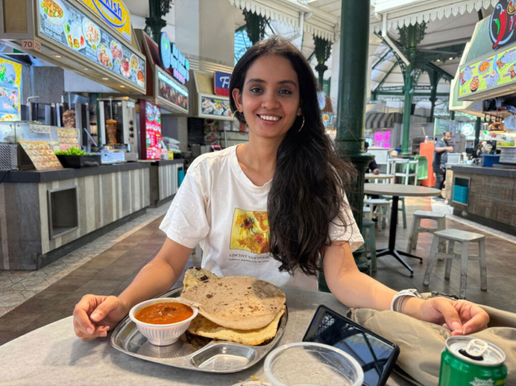 Author Advaita enjoying a meal at Lau Pa Sat Hawker Center