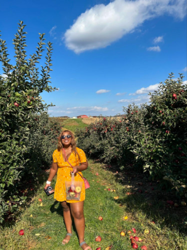 Author Alexandria picking apples at Baugher’s Orchard
