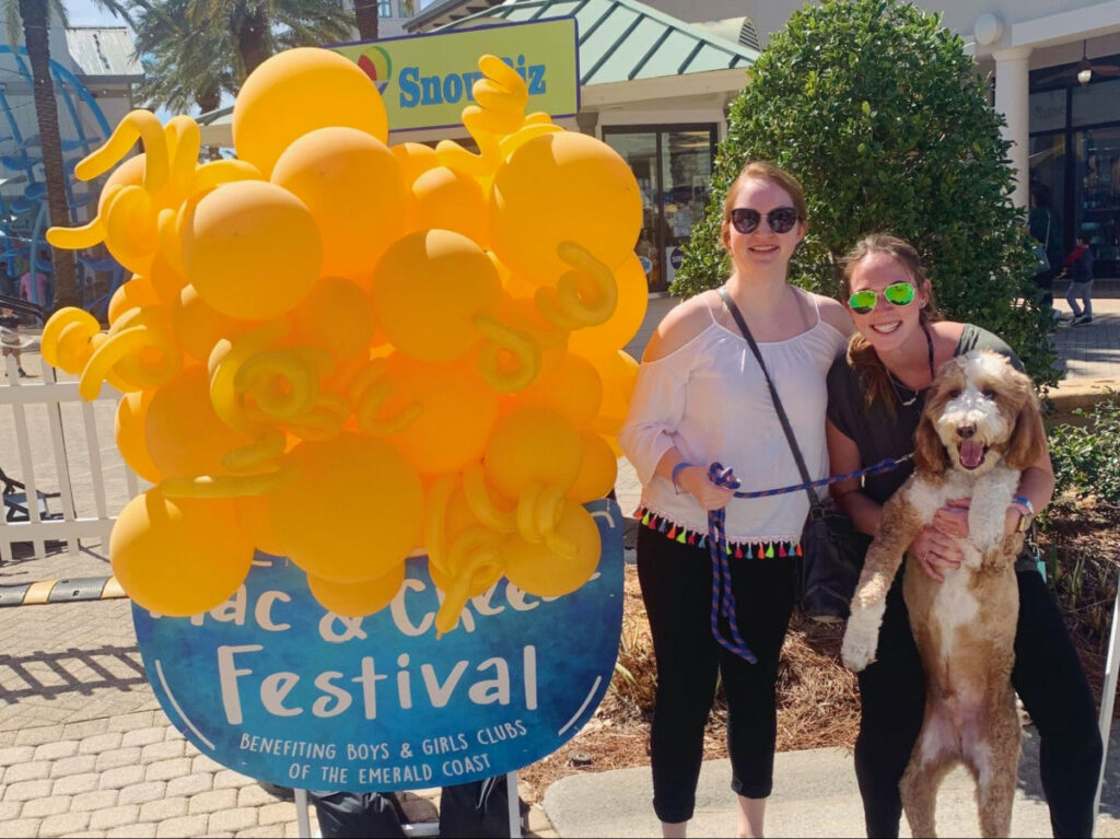 Author Allie with her sister and dog at the Mac & Cheese Festival