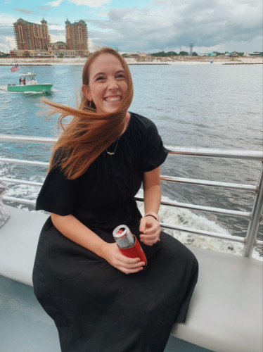 Author Allie enjoying the ride at the Sunset Dolphin Cruise