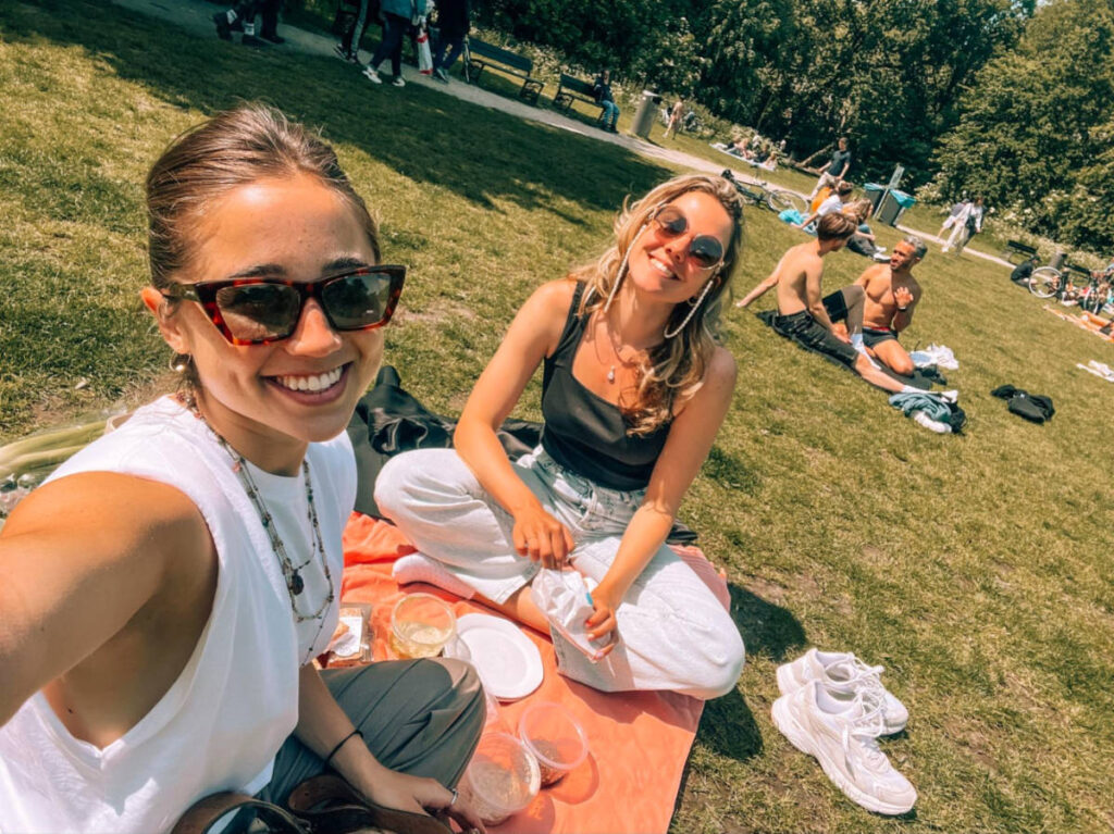 Author Amber and her friend having a picnic in Vondelpark